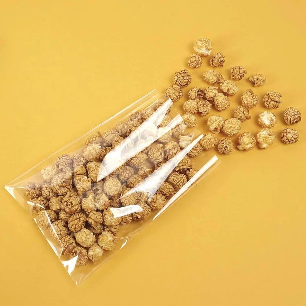 Sacchetti in Cellophane Trasparente 14x20 cm 100 Pezzi con Fiocchi e Lacci per Alimenti Confezioni Regalo