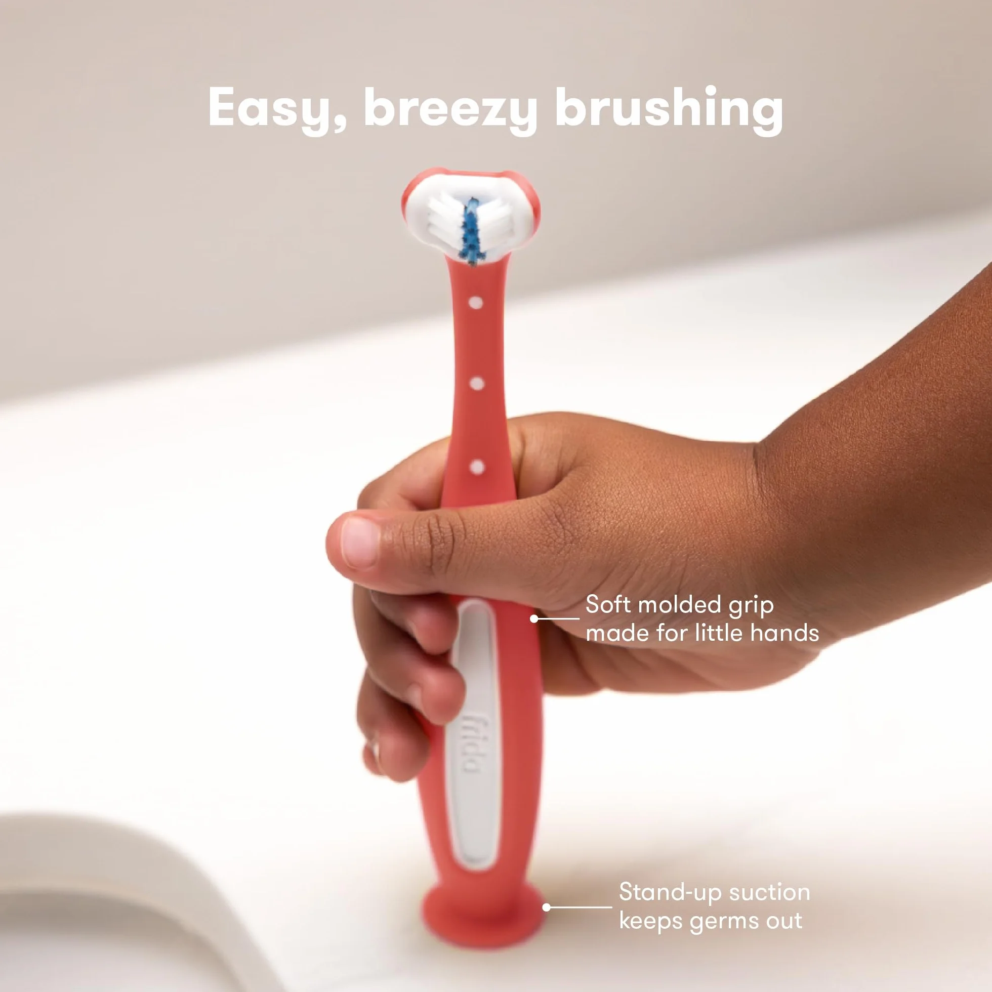 Frida Baby ToothHugger Spazzolino Bambini Triangolare – Testina 3 Lati per Pulizia Completa, Setole Morbide con Indicatore di Usura – Rosa, dai 12mesi