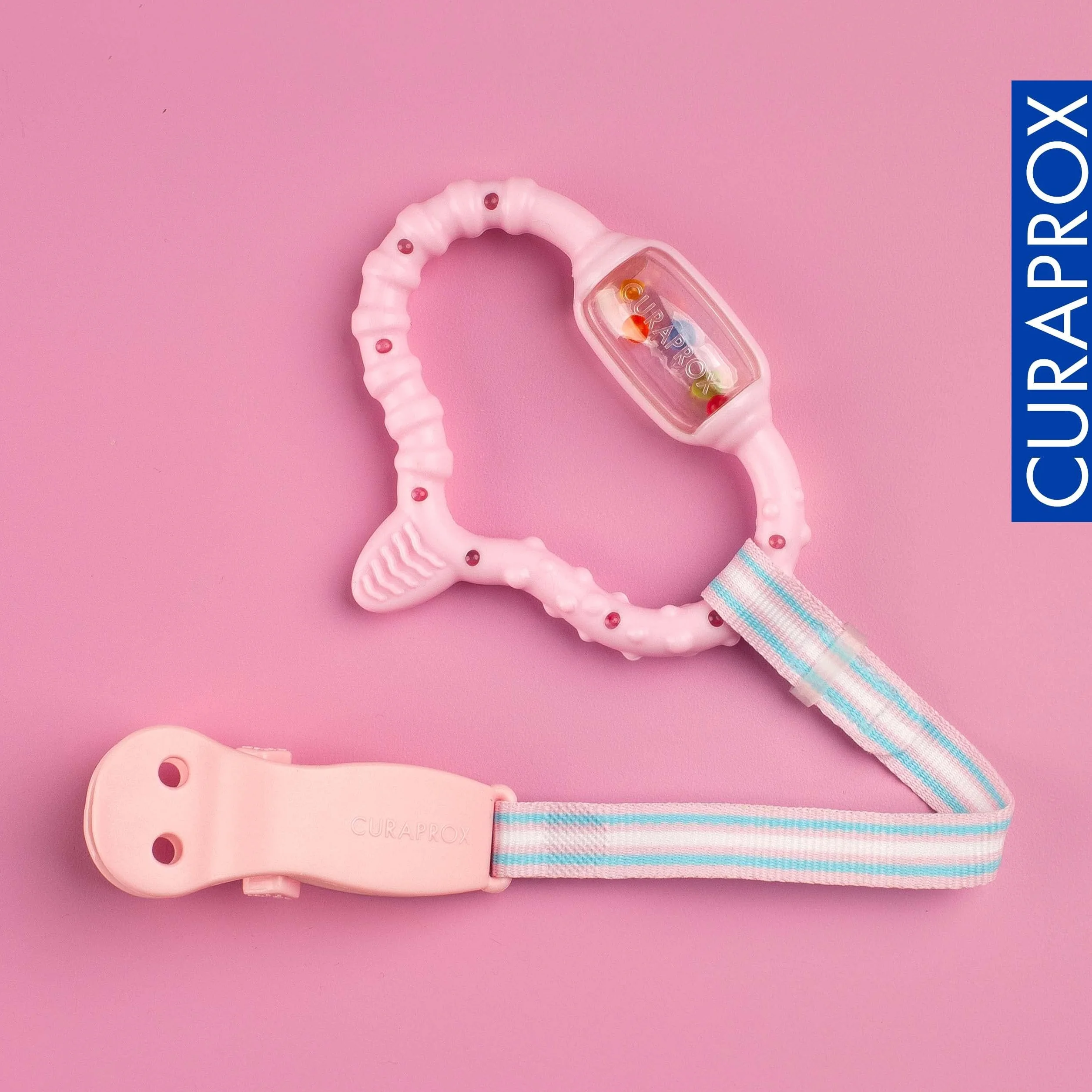 Curaprox Baby Dentizione Anello-Per neonati 0-24 mesi/Lenisce dentizione disagio e incoraggia le capacità motorie/BPA-Free, Rosa, con la formazione spazzolino da denti | Made in Switzerland
