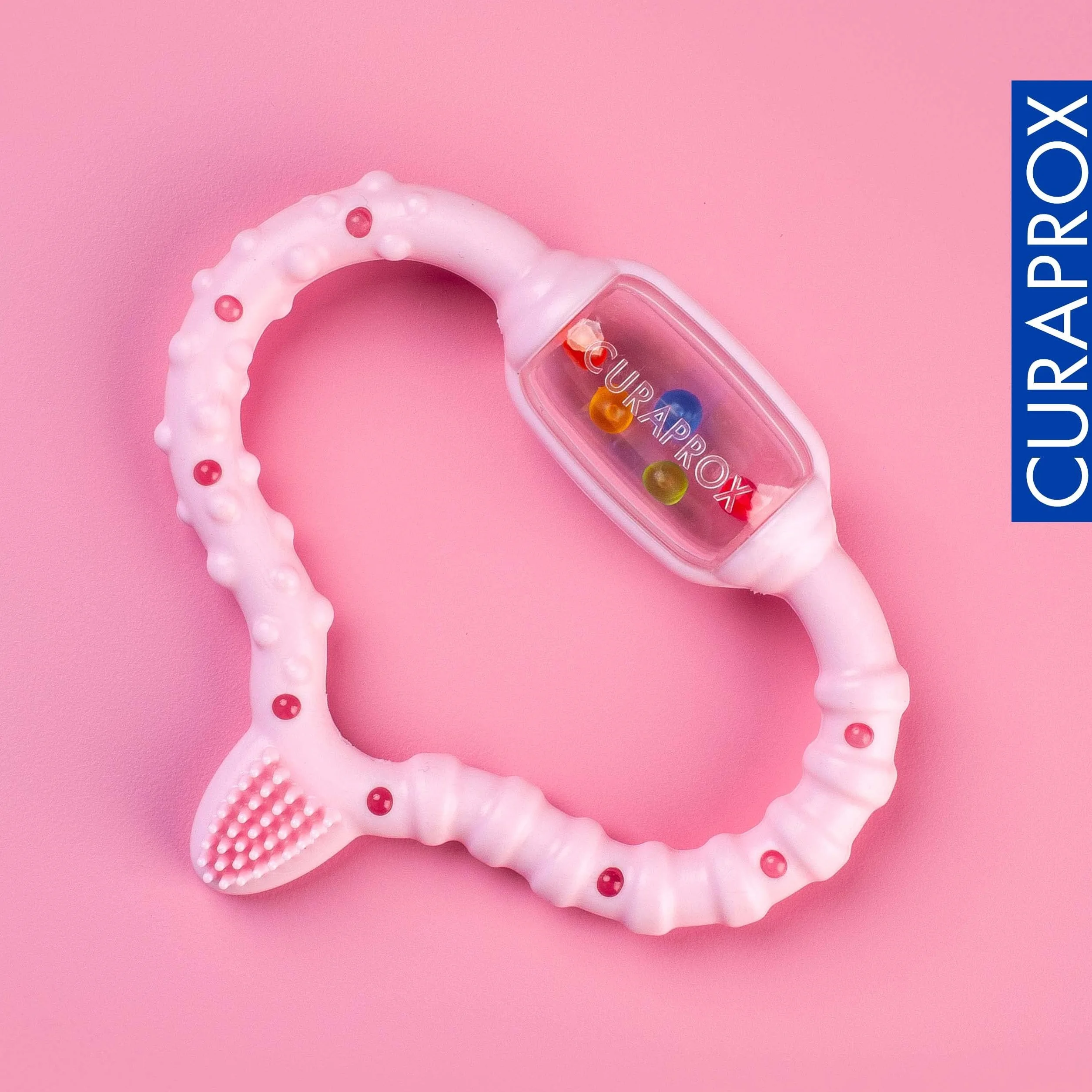 Curaprox Baby Dentizione Anello-Per neonati 0-24 mesi/Lenisce dentizione disagio e incoraggia le capacità motorie/BPA-Free, Rosa, con la formazione spazzolino da denti | Made in Switzerland